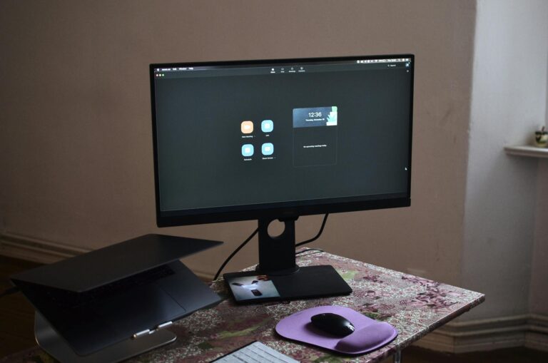 Modern computer with laptop on table